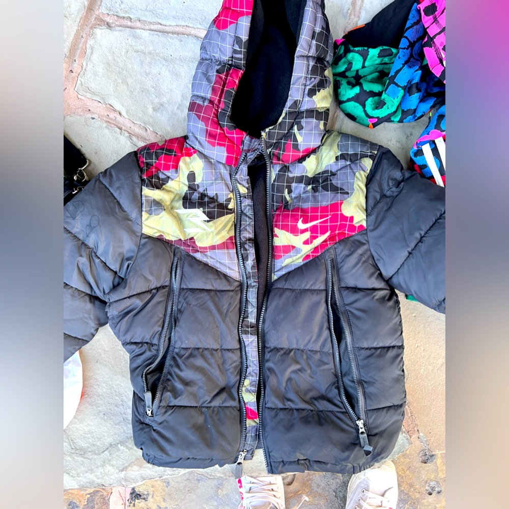 Boys Nike winter puffer coat. Has large tear on side that needs sewn